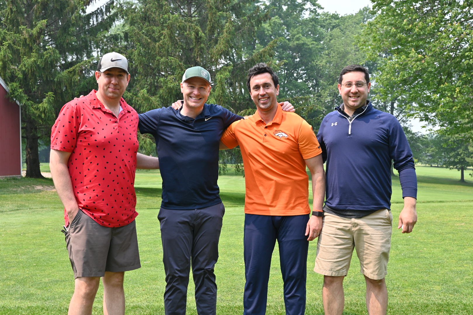 Four tournament participants posing